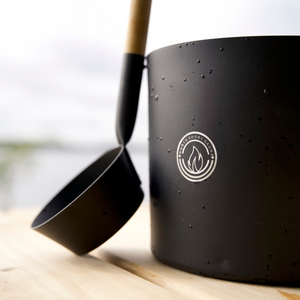 Picture of 5L Black Aluminum Sauna Bucket and Ladle Set with Elegant Bamboo Handle leaning on bucket