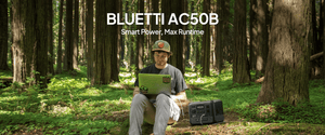 Bluetti AC50B charging laptop in forest