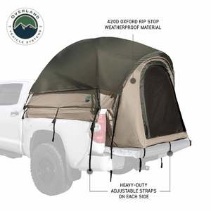Overland Vehicle Systems LD TACT Truck Bed Tent close up view while strapped to truck