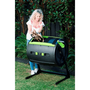 Riverstone Maze 65 Gallon Compost Tumbler with woman putting compostables