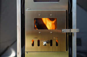 North Shore Sauna Portable Tent Wood Stove with flames showing inside