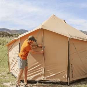 White Duck Outdoors Altimus Bell Tent being closed by man