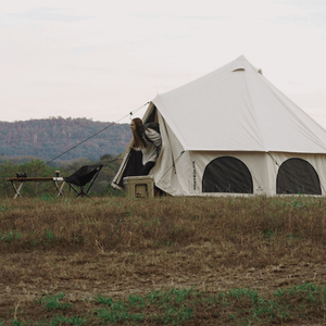 White Duck Outdoors Avalon Bell Tent with woman coming out