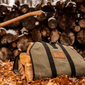 White Duck Outdoors Diamond Canvas Log Carrier Bag olive with logs on dry leaves