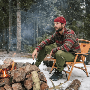 White Duck Outdoors Essential Stretch Jogger Pants with man beside campfire