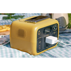 Photo of Bluetti - AC30 300Wh/300W Portable Power Station in color yellow with mobile phone on top of it.