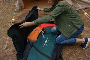 Photo of Disc-O-Bed 2XL Roller Bag on the ground being open by a lady.