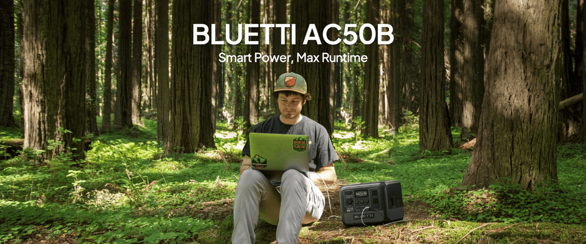 Bluetti AC50B charging laptop in forest