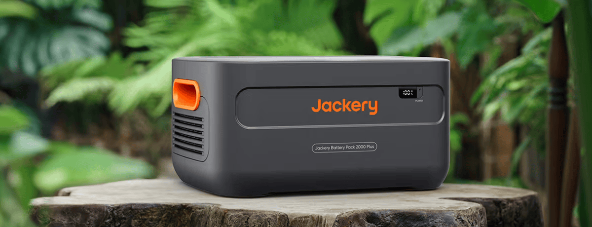 Jackery Battery Pack 2000 Plus on tree stump in jungle
