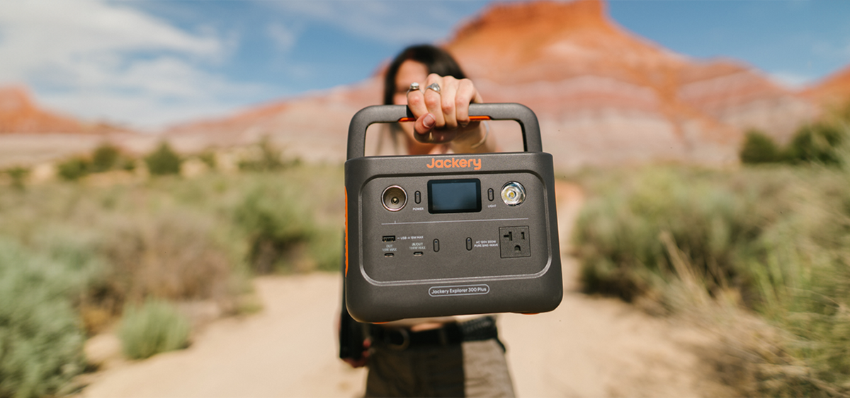 Jackery Explorer 300 Plus held by woman outdoors