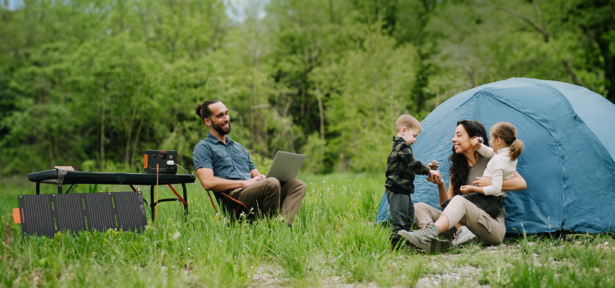 Jackery Explorer 300 Plus solar charging and powering laptop while camping
