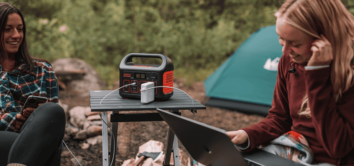 Jackery Explorer 300 camping powering laptop and phone