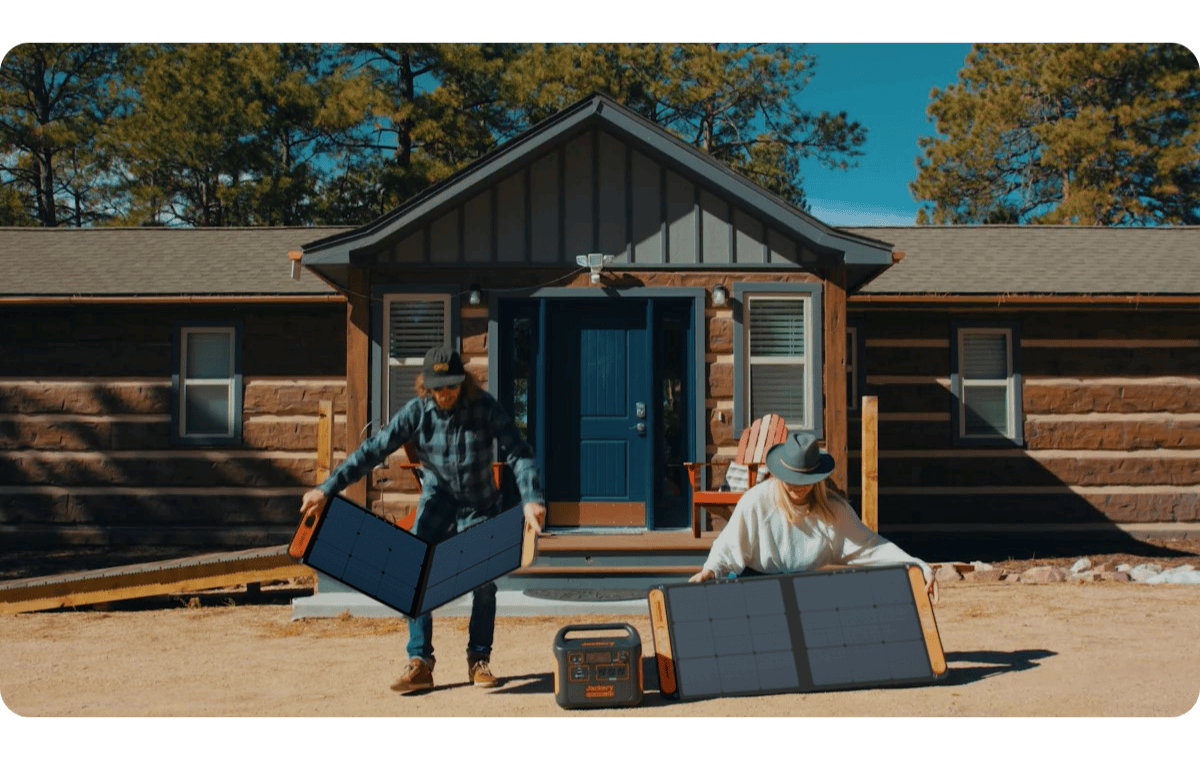 Jackery SolarSaga 100W Solar Panel being set up outside cabin