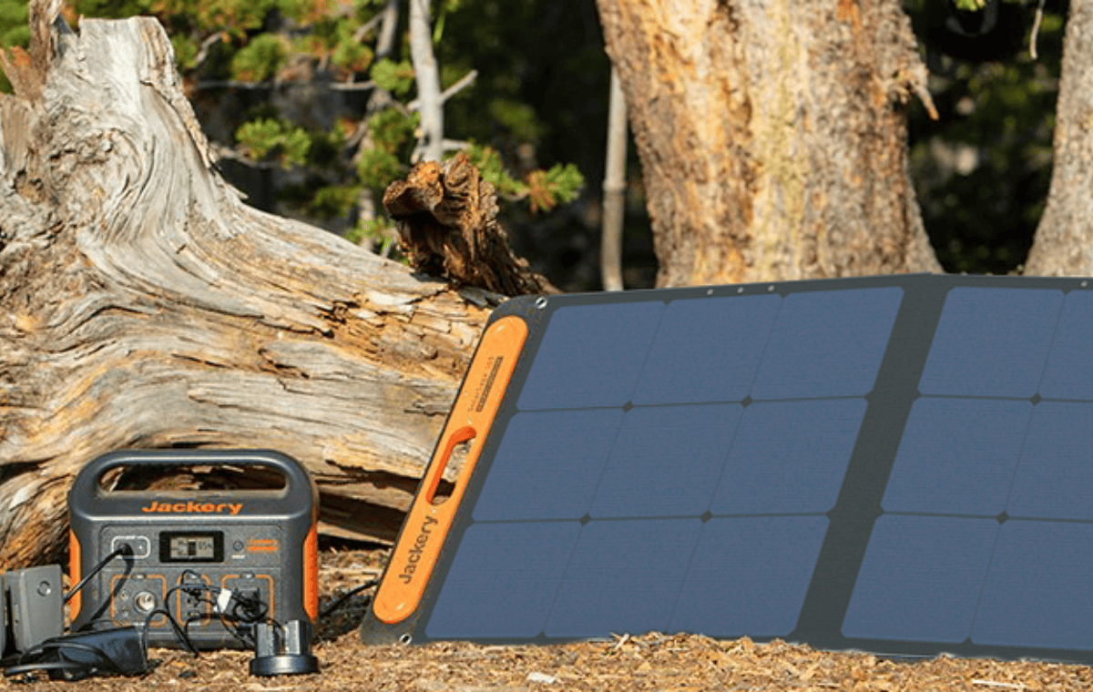 Jackery SolarSaga 100W Solar Panel charging generator in the woods