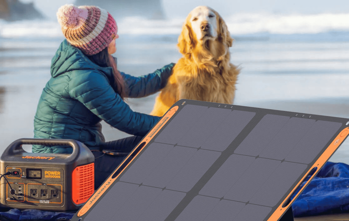 two Jackery SolarSaga 100W Solar Panels charging generator on beach