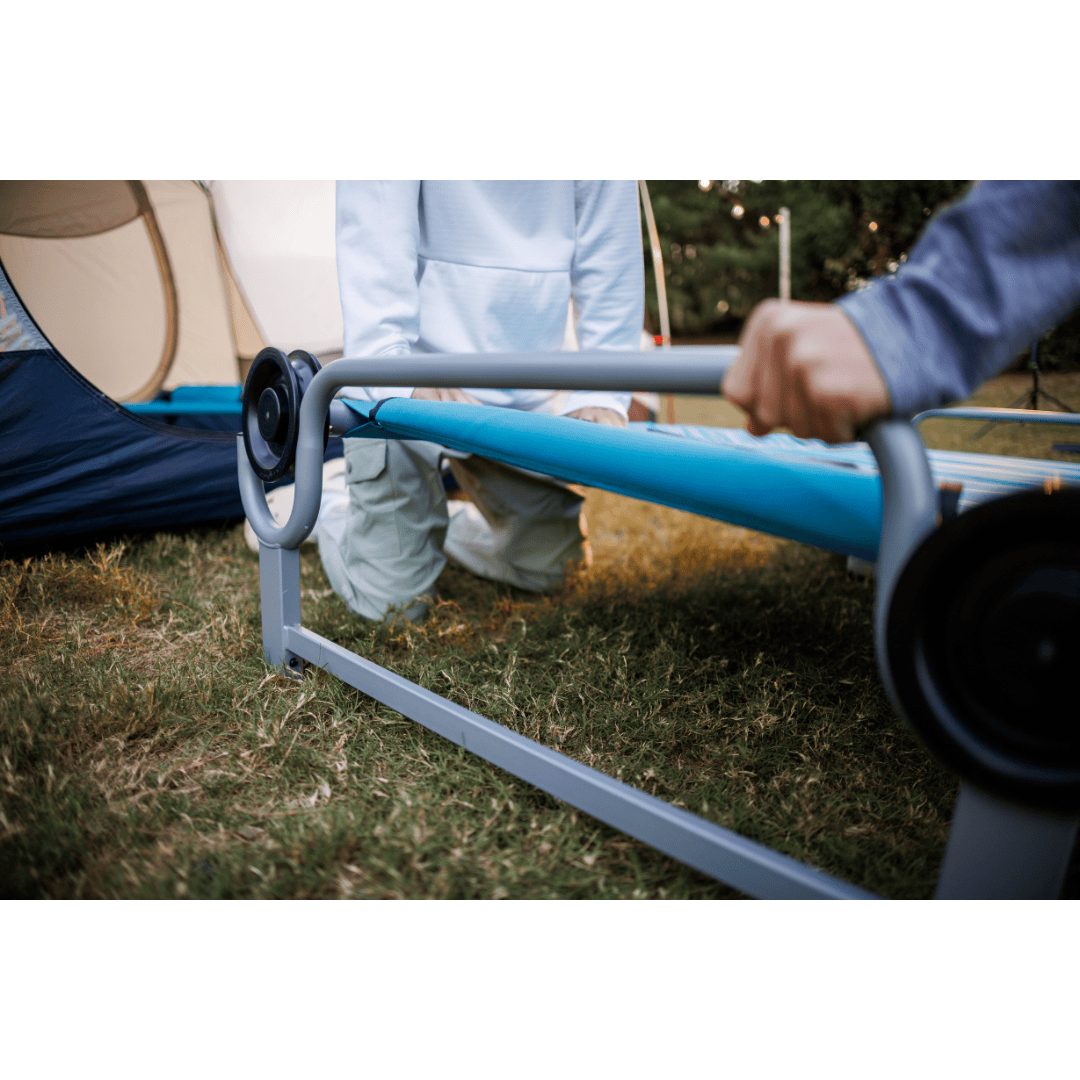 Kid-O-Bed single kids camping bunk bed being set up outdoors