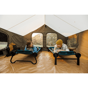 Large Disc-O-Bed Portable Cot System unstacked with two people laying face down
