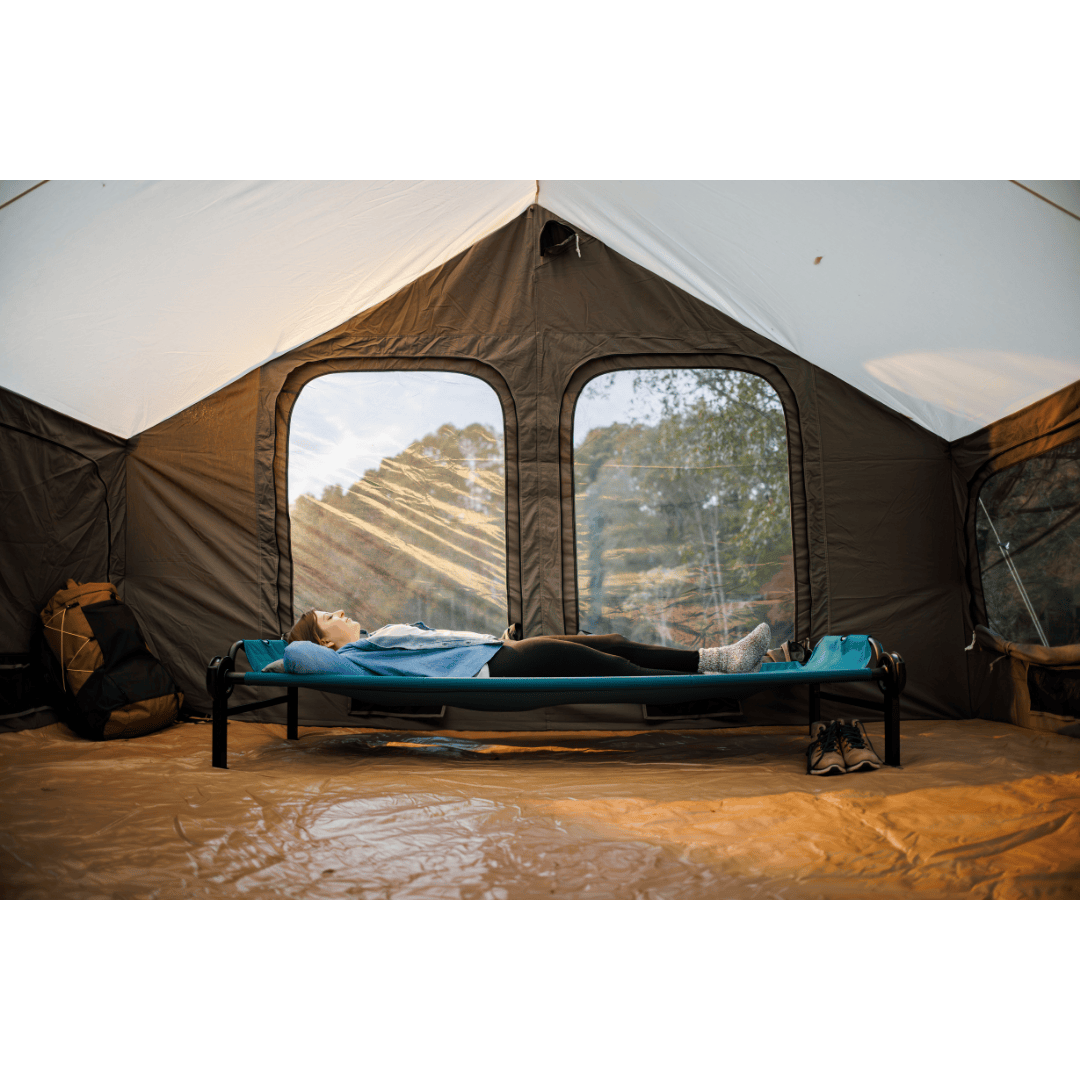 Large Disc-O-Bed Portable Cot System unstacked with two people sleeping