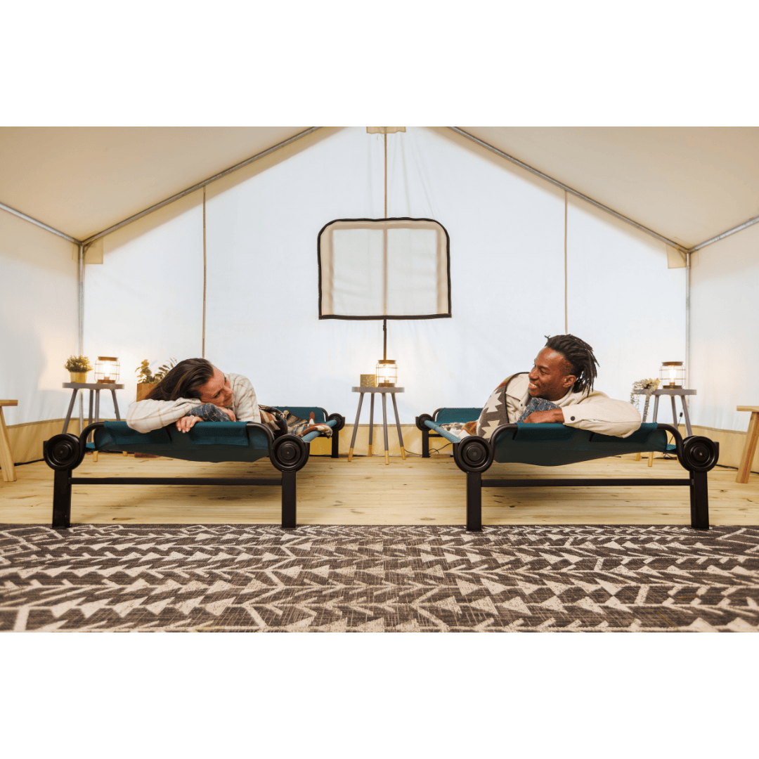 Large Disc-O-Bed Single Camping Cot with man and woman laying side by side