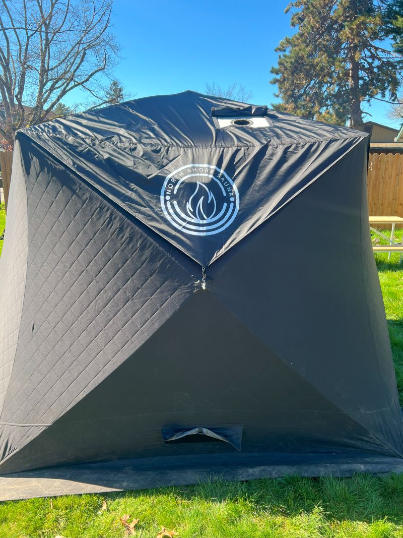 Picture of North Shore Sauna Tent Rain Cover set up in backyard