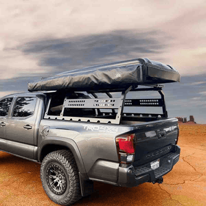 Overland Vehicle Systems Discovery Rack for Mid-Size Truck Short Beds installed with rooftop tent on tacoma