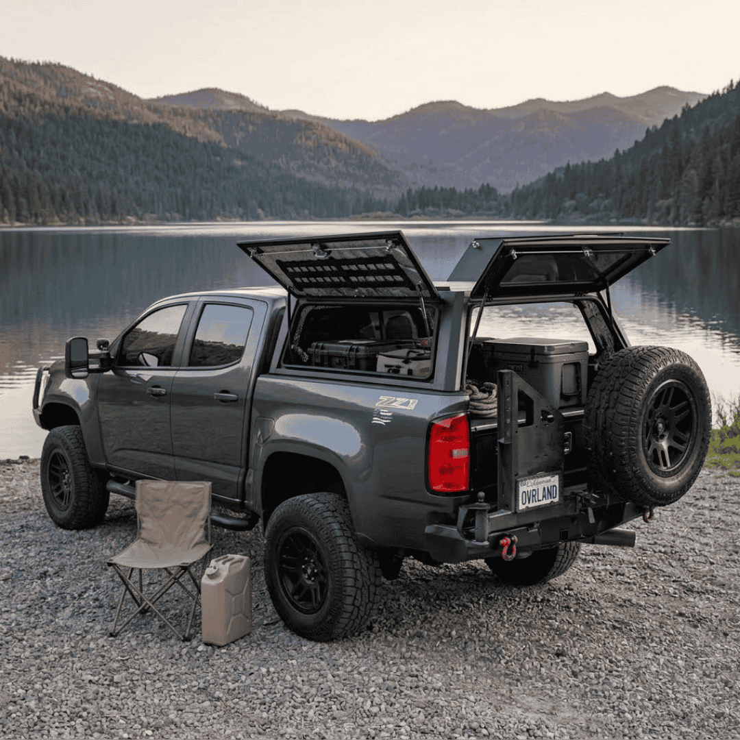 Overland Vehicle Systems Expedition Truck Cap for 2015 to 2022 GM Colorado/Canyon - 5 ft. Bed parked with panels opened