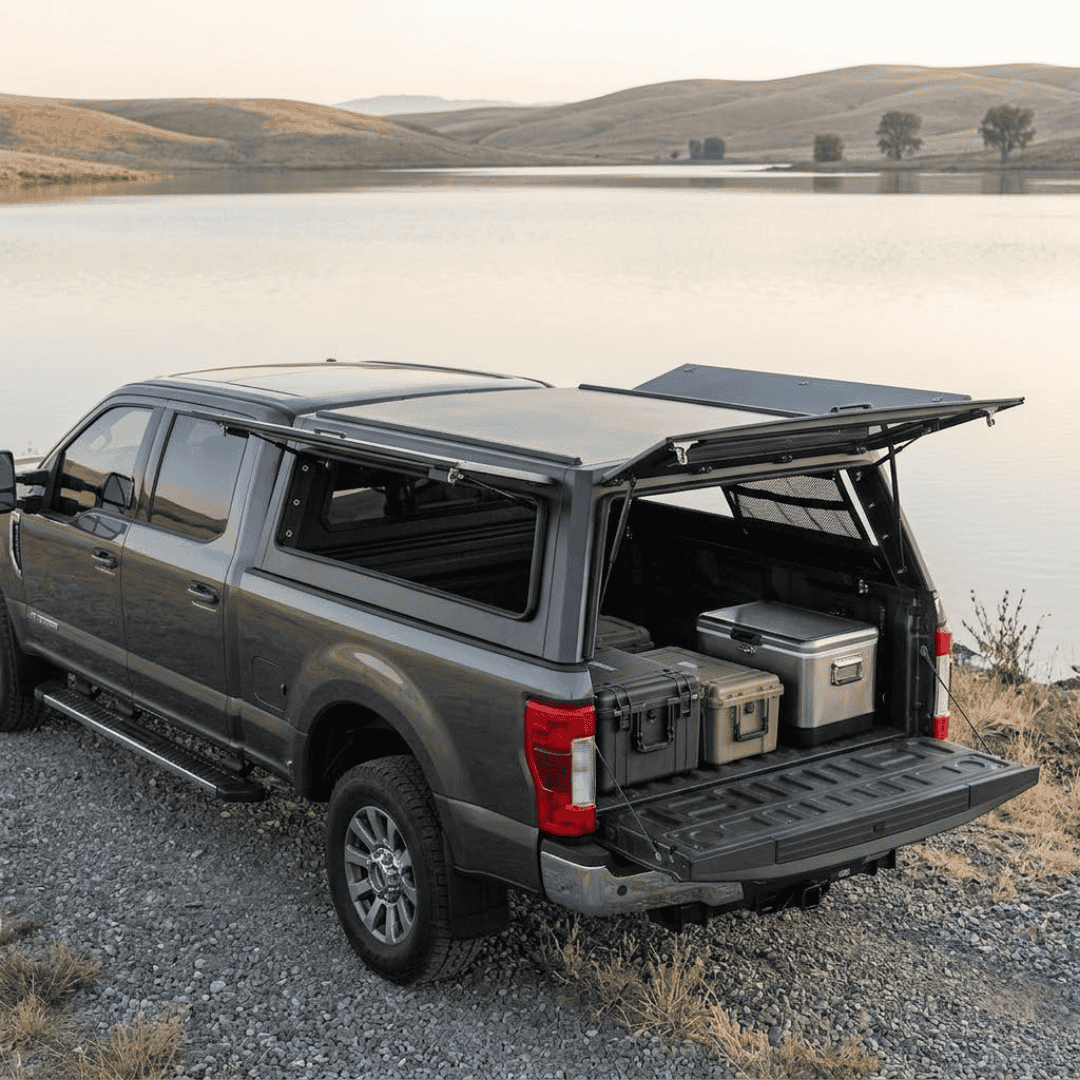 Overland Vehicle Systems Expedition Truck Cap for 2017 to 2022 Ford F-250/F-350 6.8 ft. Bed parked with panels opened