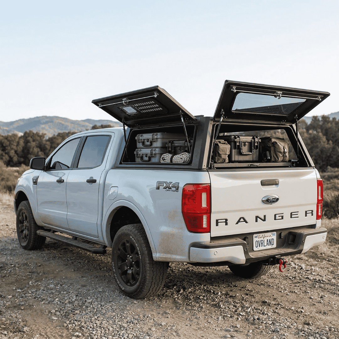 Overland Vehicle Systems Expedition Truck Cap for 2019 to 2023 Ford Ranger - 5 ft. Bed parked with panels opened