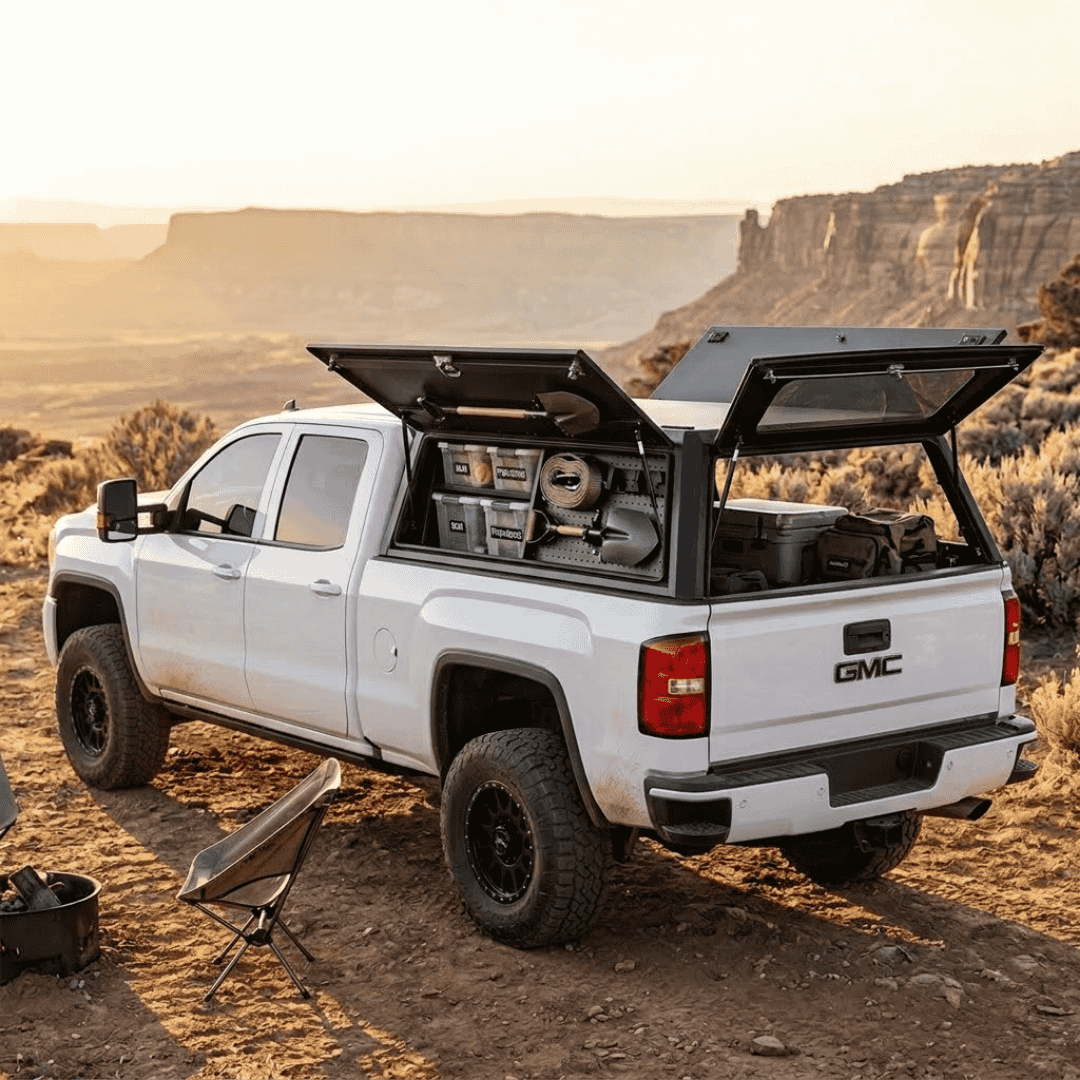 Overland Vehicle Systems Expedition Truck Cap for 2020 to 2026 GM 2500/3500 Short Bed - 6.9 ft. Bed parked with panels opened