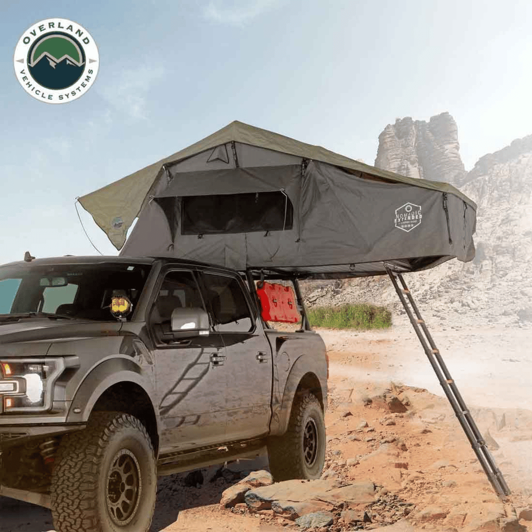 Overland Vehicle Systems HD Nomadic 4 Extended Soft Shell Roof Top Tent Installed on top of Vehicle