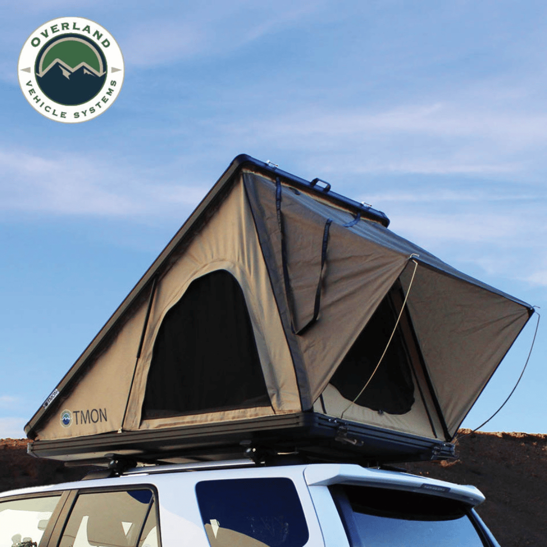 Overland Vehicle Systems LD TMON Clamshell Aluminum Hard Shell Roof Top Tent On top of Vehicle
