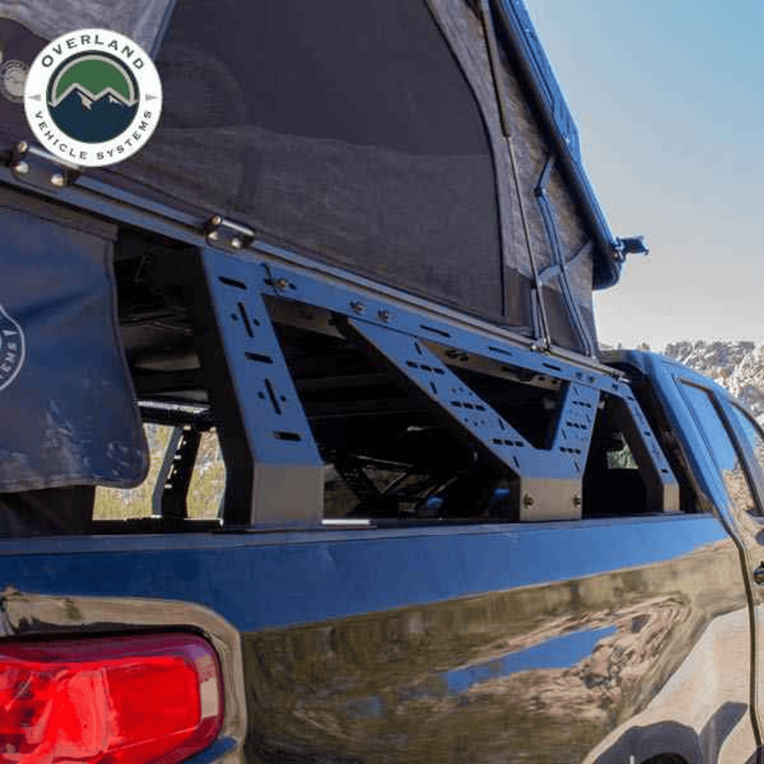 Overland Vehicle Systems Universal Mid Height Rack for Pick Up Trucks window view with rooftop tent