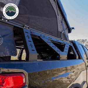 Overland Vehicle Systems Universal Mid Height Rack for Pick Up Trucks window view with rooftop tent