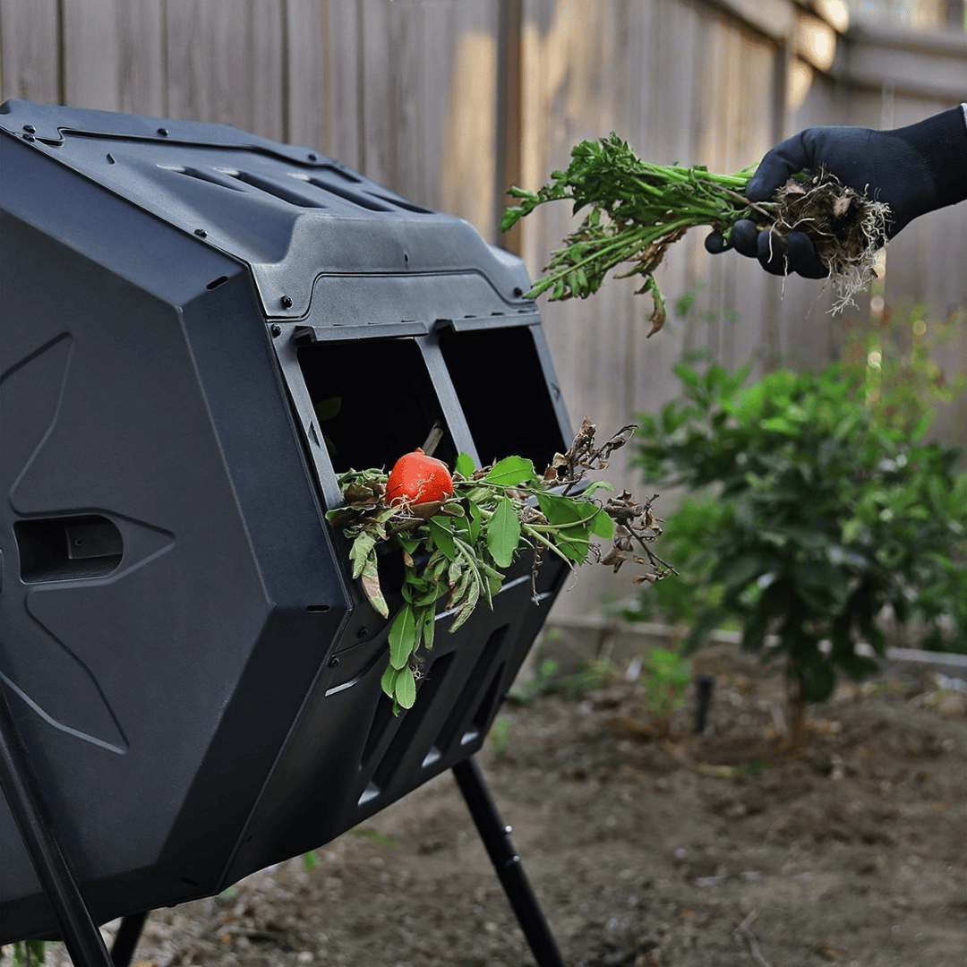 Riverstone Genesis 42 Gallon Compost Tumbler with new waste being inserted