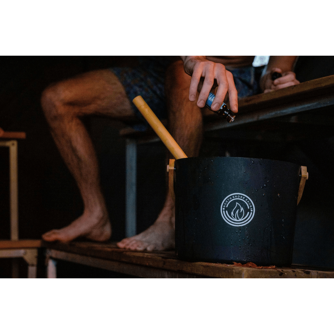 Sauna in Nature Essential Oil Blend Being Added to Water