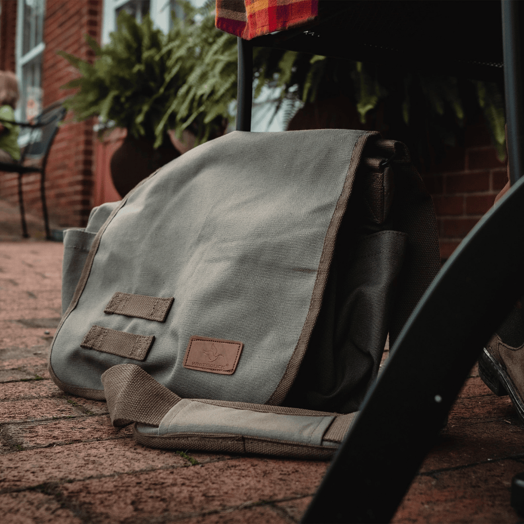 White Duck Outdoors Filios Messenger Bag Olive on the floor