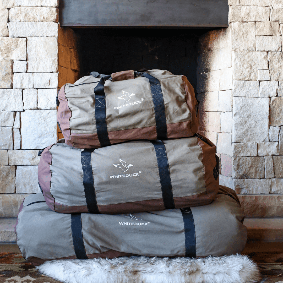 White Duck Outdoors Filios Canvas Duffel Bag olive and brown stacked