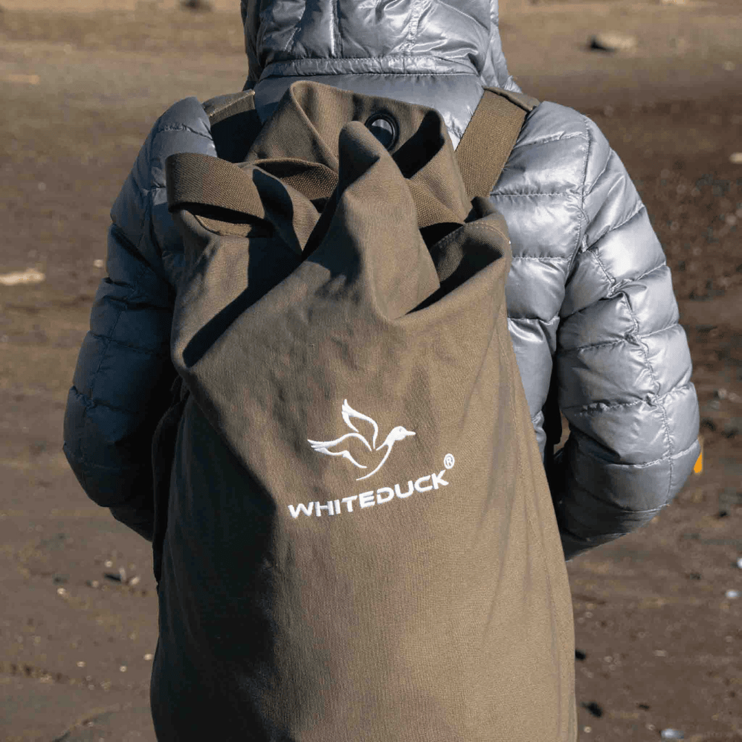 White Duck Outdoors Hoplite GI Canvas Top Load Bag being worn