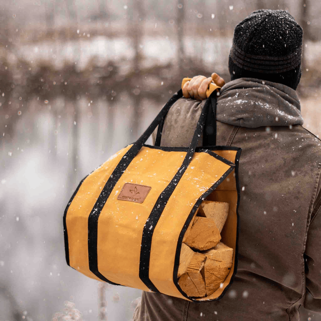 White Duck Outdoors Rectangle Canvas Log Carrier Bag Tan with Man Carrying Logs