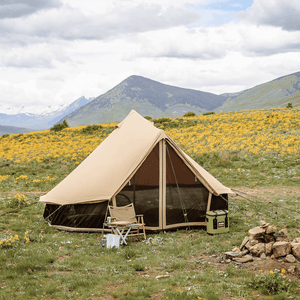 White Duck Outdoors Regatta Double Wall Bell Tent in grasy area with flowers and chairs
