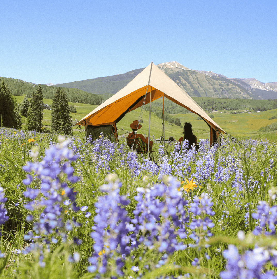White Duck Outdoors Rover Scout Tent with couple in flower field