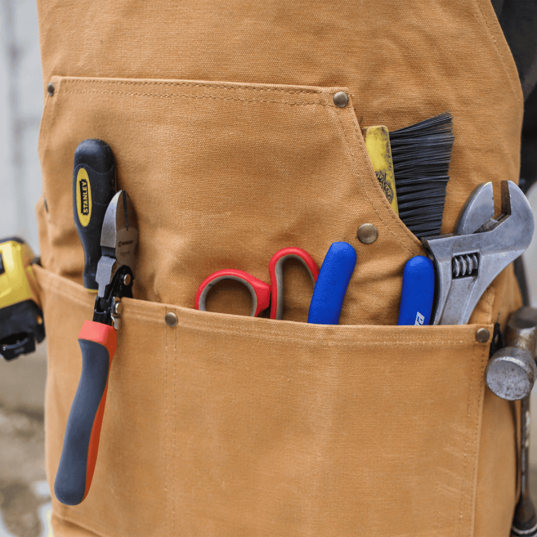 White Duck Outdoors Tan Work Apron with tool-filled pockets