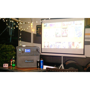 Photo of Bluetti - AC200 1700Wh/2000W Portable Power Station hooked in a projector.