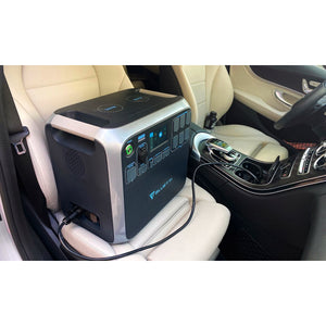 Photo of Bluetti - AC200 1700Wh/2000W Portable Power Station charged in a car and placed in a passenger seat.