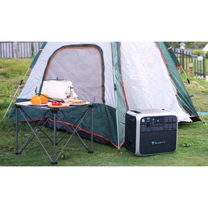 Photo of Bluetti - AC200 1700Wh/2000W Portable Power Station outside a tent.