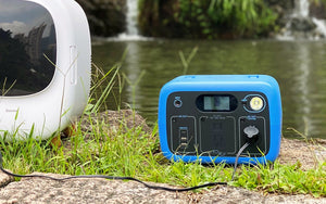 Photo of Bluetti - AC30 300Wh/300W Portable Power Station in color blue placed near a waterfalls.