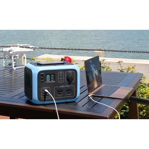 Photo of Bluetti - AC50S 500Wh/300W Portable Power Station hooked in a laptop.