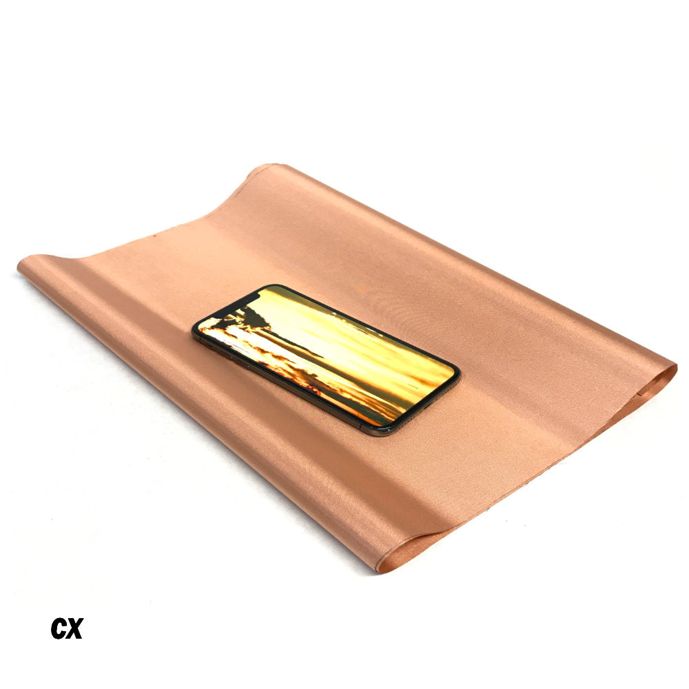 Picture of  a CX CYBER Faraday Fabric EMF RF Shielding Copper Fabric Roll 44″ x 1′ with a cellphone above it.