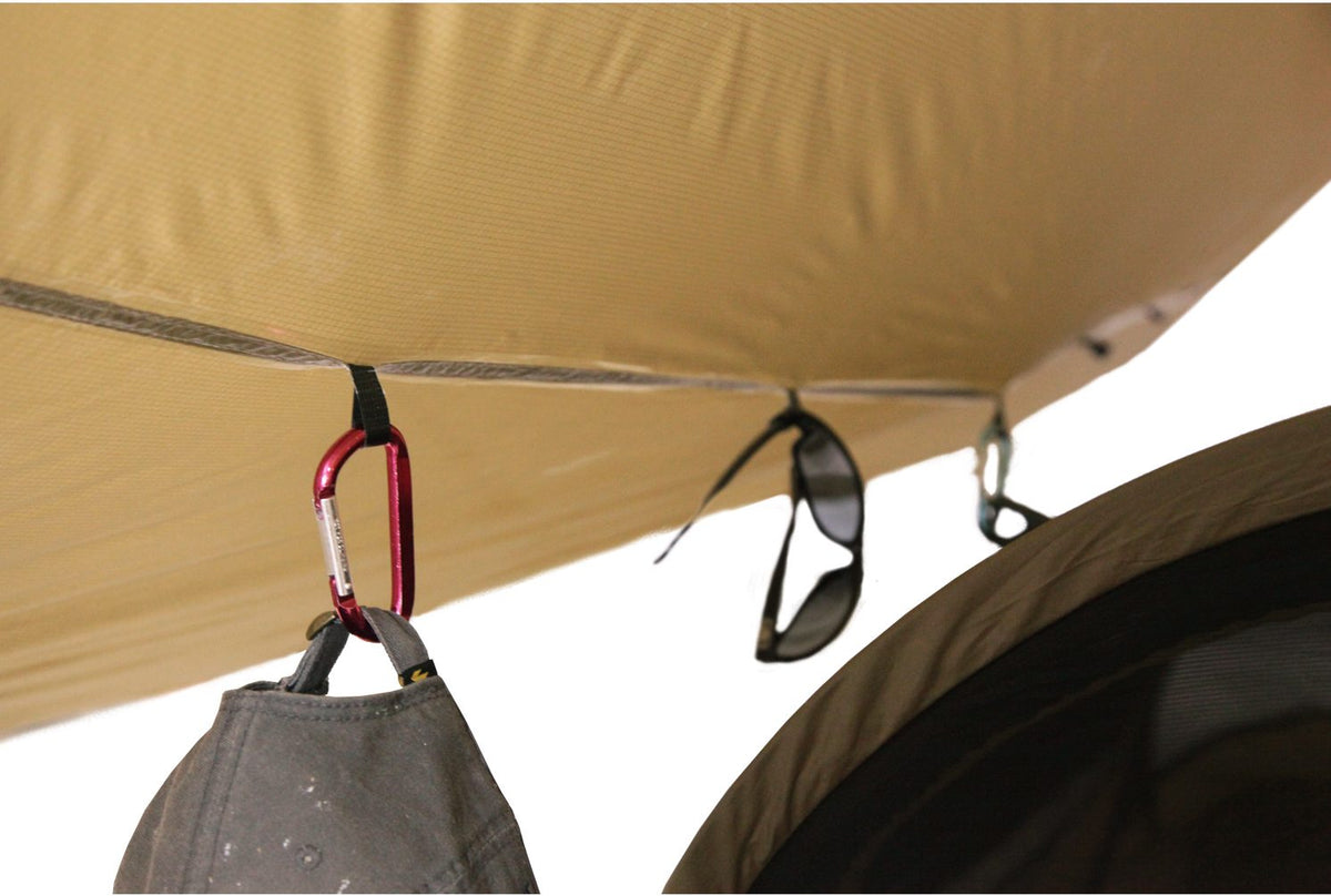 Photo of the inside of the Catoma Gopher Tarp System with cap and eyeglasses hooked in it.