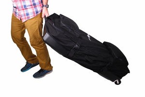 Photo of Disc-O-Bed 2XL Roller Bag in a white background being carried.
